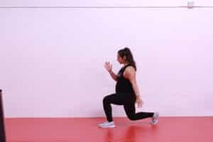 prenatal woman doing lunge exercise